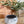 Alpaca fleece grey and white felted small bowl with plant in background.